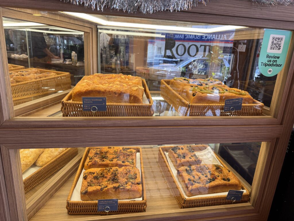 A variety of freshly baked Italian focaccia breads on display at Roots Bistro bakery section.
