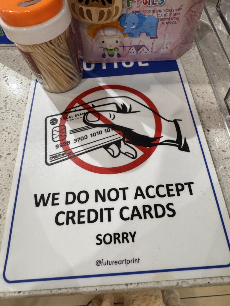 Sign at Jojo Little Kitchen stating that credit cards are not accepted