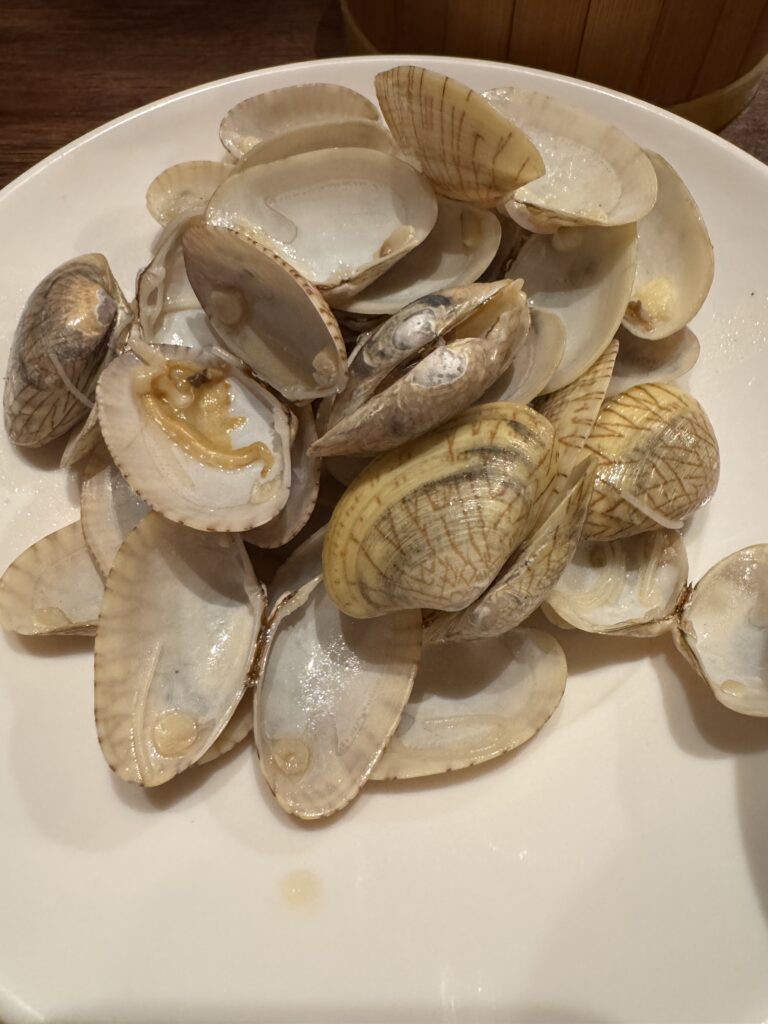 Empty clam shells left after eating a bowl of lala noodles at Lai Foong Lala Noodles.