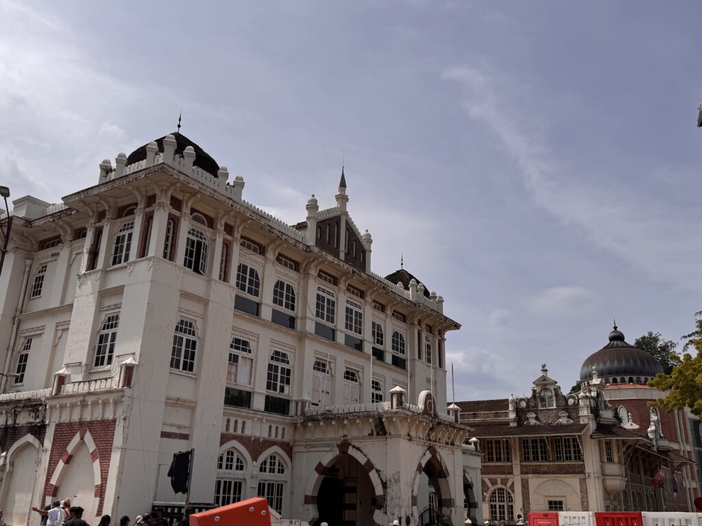 Colonial-era buildings near Merdeka Square in Kuala Lumpur city centre under a clear sky.
