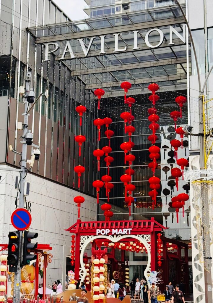 Red Chinese lantern decorations hanging at Pavilion Kuala Lumpur mall entrance for Lunar New Year in Malaysia.