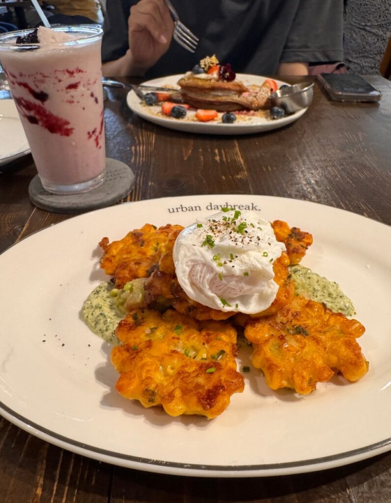 Urban Daybreak corn fritters served with avocado cream and poached egg, Australian-style brunch in Bangsar.