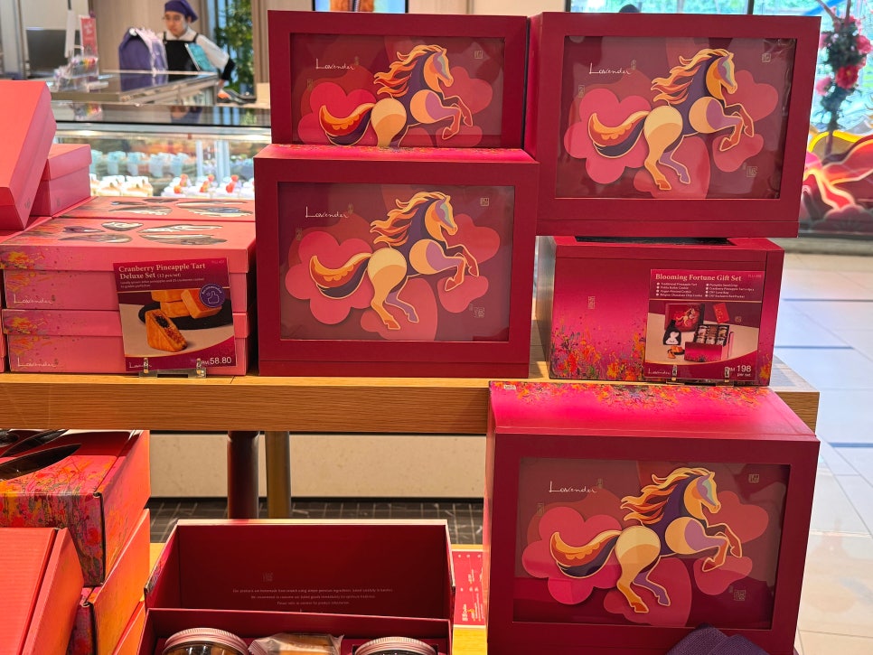 Lunar New Year pineapple tart gift box with horse illustration symbolizing the zodiac year.