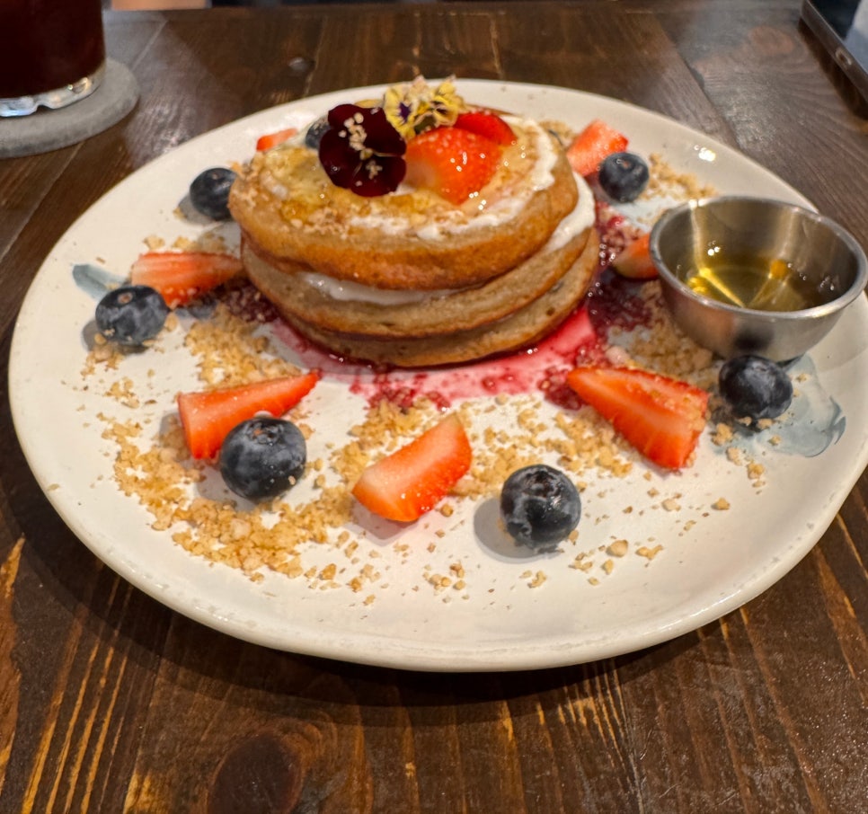 Vegan berry pancake at Urban Daybreak topped with coconut yogurt, strawberries and blueberries in Kuala Lumpur.