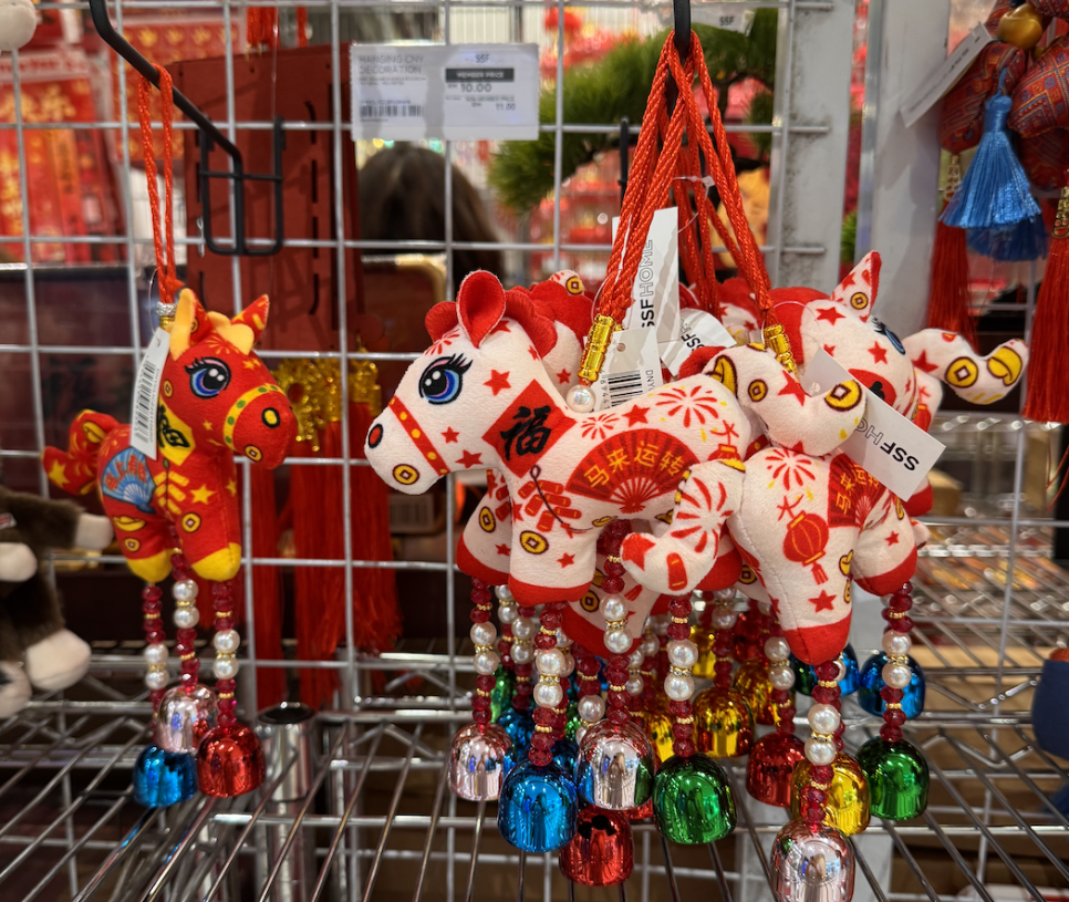 White Lunar New Year horse ornament with Chinese phrase. 