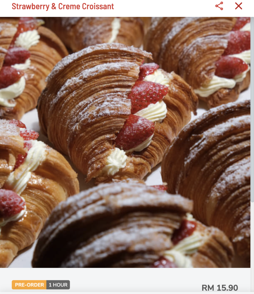 Strawberry and cream croissant from KLCG Confectionery & Bakery, filled with fresh cream and strawberries.