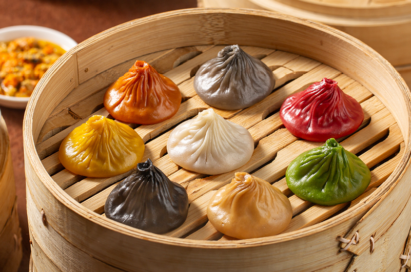 Paradise Dynasty menu listing the 8 different flavors of Xiao Long Bao including original, garlic, and Korean kimchi.